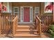 Welcoming front porch with a charming front door, featuring beautiful stone accents and a cozy seating area at 47 Powder Springs St, Hiram, GA 30141