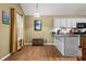 Charming kitchen area featuring hardwood floors, neutral walls and grey countertops at 47 Powder Springs St, Hiram, GA 30141