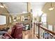 Open concept living room with hardwood floors and neutral walls, conveniently located near the kitchen at 47 Powder Springs St, Hiram, GA 30141