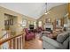 Comfortable living room with a fireplace, hardwood floors, and neutral colors with lots of natural light at 47 Powder Springs St, Hiram, GA 30141
