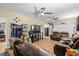 Inviting living room with hardwood floors, ceiling fans, comfortable seating, and a modern fireplace at 47 Powder Springs St, Hiram, GA 30141
