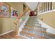A carpetless staircase is detailed with geometric tiles up the steps to the second level at 47 Powder Springs St, Hiram, GA 30141