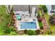 Overhead shot of a backyard with a pool, hot tub, patio furniture, and meticulously maintained landscaping at 520 Weatherend Ct, Johns Creek, GA 30022