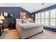 Comfortable bedroom featuring a plush bed, vaulted ceiling, and stylish decor at 520 Weatherend Ct, Johns Creek, GA 30022