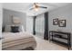 Serene bedroom features a striped bed, ceiling fan, and decor at 520 Weatherend Ct, Johns Creek, GA 30022