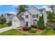 Lovely two-story home with well-manicured lawn, two-car garage, and beautiful landscaping at 520 Weatherend Ct, Johns Creek, GA 30022