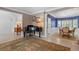 Front foyer featuring a piano, dining area and living room, with ample natural light and neutral décor at 520 Weatherend Ct, Johns Creek, GA 30022