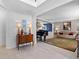 Inviting foyer features a beautiful rug, wood accents, and leads to a living room and dining room at 520 Weatherend Ct, Johns Creek, GA 30022