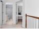 Upstairs hallway with views into bedroom and bathroom at 520 Weatherend Ct, Johns Creek, GA 30022