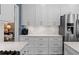 Spacious kitchen featuring granite countertops, stainless steel appliances, and ample storage at 520 Weatherend Ct, Johns Creek, GA 30022