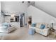 Open-concept living room and kitchen area with natural light and cozy seating at 520 Weatherend Ct, Johns Creek, GA 30022