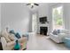 Bright living room with high ceilings, fireplace, and large windows with natural light at 520 Weatherend Ct, Johns Creek, GA 30022