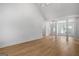 Spacious living room with high ceilings, hardwood floors, and decorative columns, creating an elegant atmosphere at 1155 Graystone Xing, Alpharetta, GA 30005