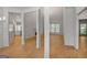Open concept living room with fireplace, hardwood floors, and seamless access to other living spaces at 1155 Graystone Xing, Alpharetta, GA 30005