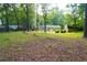 A spacious backyard with a barn and a home at 3854 Bright Star Road, Douglasville, GA 30135