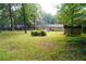 This backyard offers a storage building and mature trees at 3854 Bright Star Road, Douglasville, GA 30135