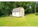 An exterior view of a barn with weathered shingles, surrounded by trees at 3854 Bright Star Road, Douglasville, GA 30135