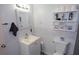 Bright bathroom featuring a sink, toilet, mirror, and tiled backsplash at 3854 Bright Star Road, Douglasville, GA 30135