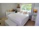 Inviting bedroom with white bedding, natural light, and ample storage space at 3854 Bright Star Road, Douglasville, GA 30135