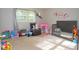 This bedroom offers a play area and comfortable chair at 3854 Bright Star Road, Douglasville, GA 30135