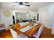 The dining room features an open floorplan, ceiling fan, and wood floors at 3854 Bright Star Road, Douglasville, GA 30135