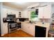 Well-lit kitchen with stainless steel appliances and white cabinets at 3854 Bright Star Road, Douglasville, GA 30135