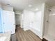 Bathroom showcasing tub and shower with a walk-in closet at 5443 Belle Meade Dr, Villa Rica, GA 30180