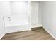 Bathroom with tub and separate shower, featuring white subway tile at 5443 Belle Meade Dr, Villa Rica, GA 30180