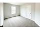 Bright bedroom with a large window and neutral carpeting at 5443 Belle Meade Dr, Villa Rica, GA 30180