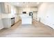 Modern kitchen featuring white cabinets, stainless steel appliances, and a functional center island at 5443 Belle Meade Dr, Villa Rica, GA 30180