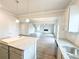 Open-concept kitchen with granite countertops connects to a spacious living area at 5443 Belle Meade Dr, Villa Rica, GA 30180