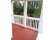 Outdoor deck with wood flooring and white railings at 6398 Shadow Sq, Lithonia, GA 30058