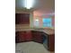 The kitchen has brown cabinets, stone countertops, and stainless steel appliances at 6398 Shadow Sq, Lithonia, GA 30058