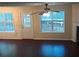 Living room with dark hardwood floors and natural light at 6398 Shadow Sq, Lithonia, GA 30058