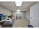 Unfinished basement featuring carpet, storage, and access door at 80 Broadlands Dr, White, GA 30184