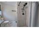 Bathroom featuring a sleek, modern shower with gray tile, stone floor, and black fixtures at 80 Broadlands Dr, White, GA 30184