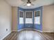 Dining area featuring blue accent wall and a corner of windows at 80 Broadlands Dr, White, GA 30184