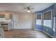 Dining area featuring wood flooring, natural light, and adjacent kitchen access at 80 Broadlands Dr, White, GA 30184