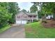 Charming home with two-car garage, covered front porch, and beautiful landscaping at 80 Broadlands Dr, White, GA 30184