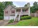 Charming home with two-car garage, covered front porch, and beautiful landscaping at 80 Broadlands Dr, White, GA 30184