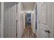 Hallway featuring luxury vinyl plank flooring and wainscoting at 80 Broadlands Dr, White, GA 30184