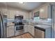 Updated kitchen with granite countertops, stainless steel appliances, and modern cabinetry at 80 Broadlands Dr, White, GA 30184