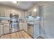 Well-lit kitchen featuring stainless steel appliances and white cabinets at 80 Broadlands Dr, White, GA 30184