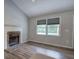 Bright living room featuring a fireplace and a large window for natural light at 80 Broadlands Dr, White, GA 30184