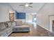 Spacious living room with hardwood floors, stone fireplace, and lots of natural light at 80 Broadlands Dr, White, GA 30184