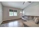 Spacious living room with hardwood floors, stone fireplace, and lots of natural light at 80 Broadlands Dr, White, GA 30184