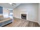 Spacious living room with hardwood floors, stone fireplace, and lots of natural light at 80 Broadlands Dr, White, GA 30184