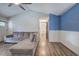Inviting living room with a gray sectional couch and accent blue wall at 80 Broadlands Dr, White, GA 30184