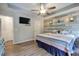 Spacious main bedroom with wood-look flooring, ample light, and a ceiling fan at 80 Broadlands Dr, White, GA 30184