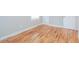 This bedroom features hardwood flooring, natural light, and neutral walls at 101 Longstreet Cir, Oxford, GA 30054